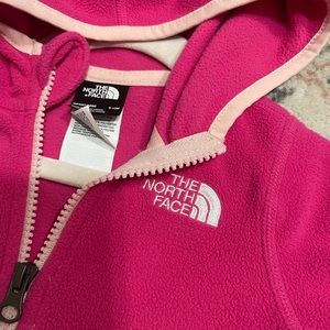 North Face Pink zip up fleece for babies with hoodie.
